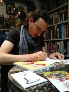 Gio sketching for Artemis Fowl Opal Deception Sketch tour